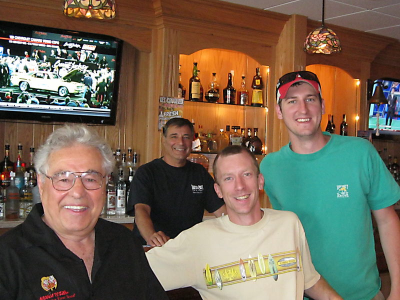 Nick Caggiano Sr. enjoys time at the downstairs bar in the new Nicola Pizza on Rehoboth Avenue with customers. Shown are (l-r) Caggiano, Nicola bartender Angelo Giordano, Scott Emery of Rehoboth Beach and William Spencer of Lewes. BY RACHEL SWICK MAVITY